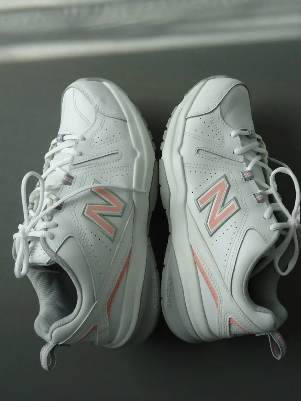 SIZE 9.5. D. New Balance women's white leather sneakers shoes.